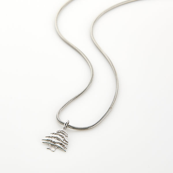 Silver necklace with a Cedar of Lebanon tree pendant, displayed on a white background.