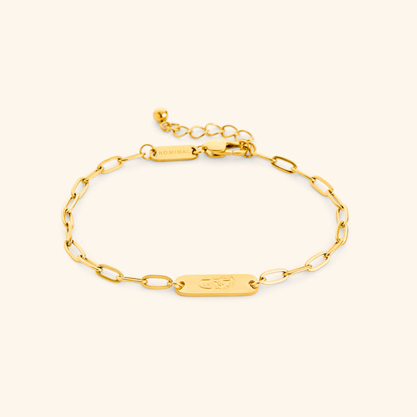 Gold My Sister Ukhti link bracelet showing the Arabic engraving on center tag, photographed against a light background.