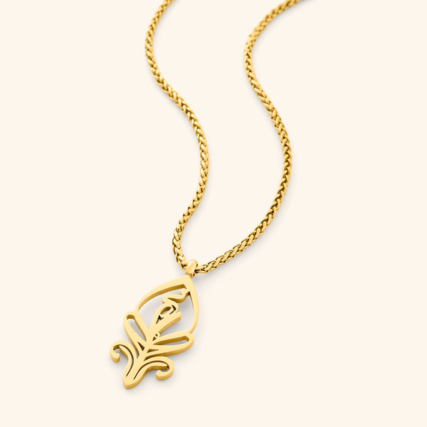 A delicate gold-plated chain necklace featuring an abstract, stylized pendant with intricate cut-out details. The pendant and chain are displayed against a light beige background.