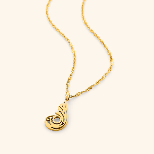 The image shows a delicate gold-plated chain necklace. The chain has a twisted or rope-like texture. The pendant is an abstract, stylized design, also in gold-plated metal, with intricate cut-out details.